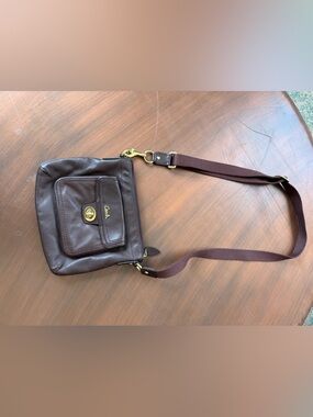 $30 final price. Coach 45012 Turnlock Pocket Swingpack in brown leather